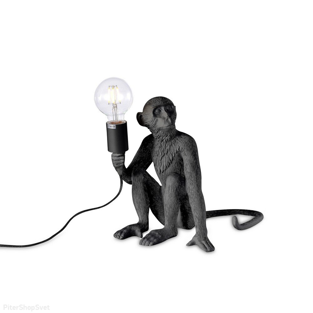 Чёрная настольная лампа обезьяна сидит с лампочкой в лапе «Magali» APL.309.24.01